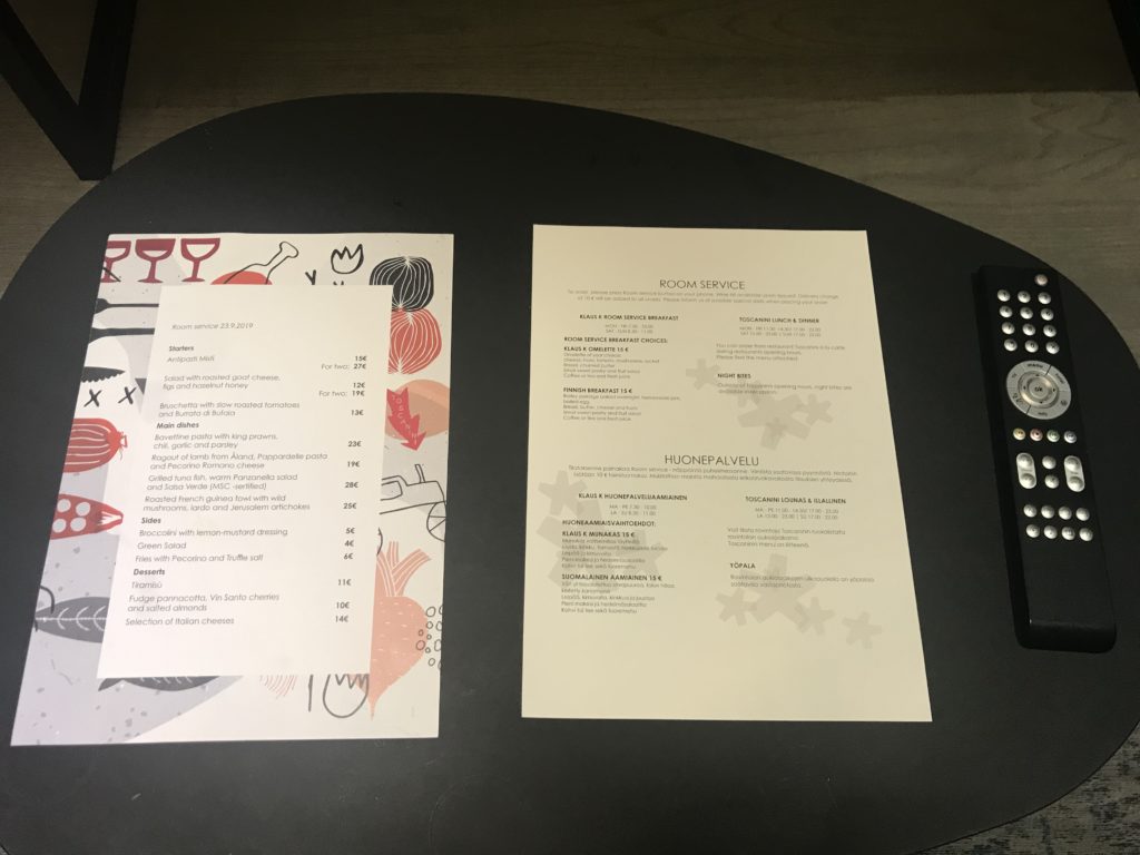 a table with a menu and a pen