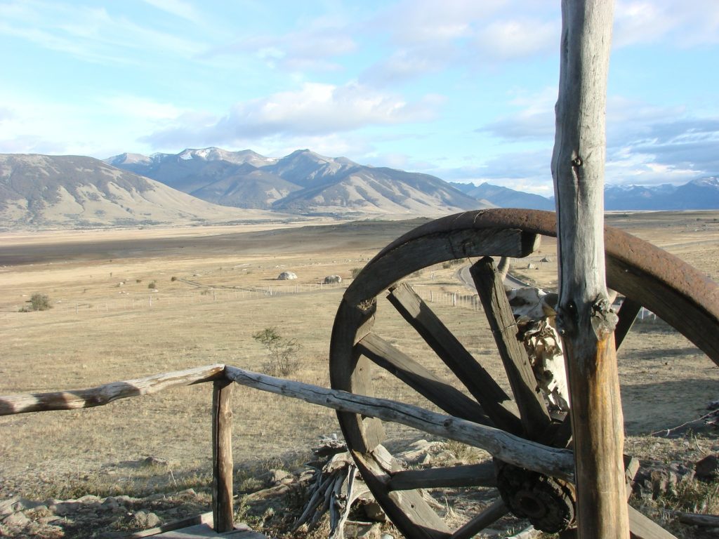 a wooden wheel in a field