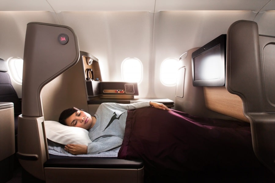 a person sleeping in a plane