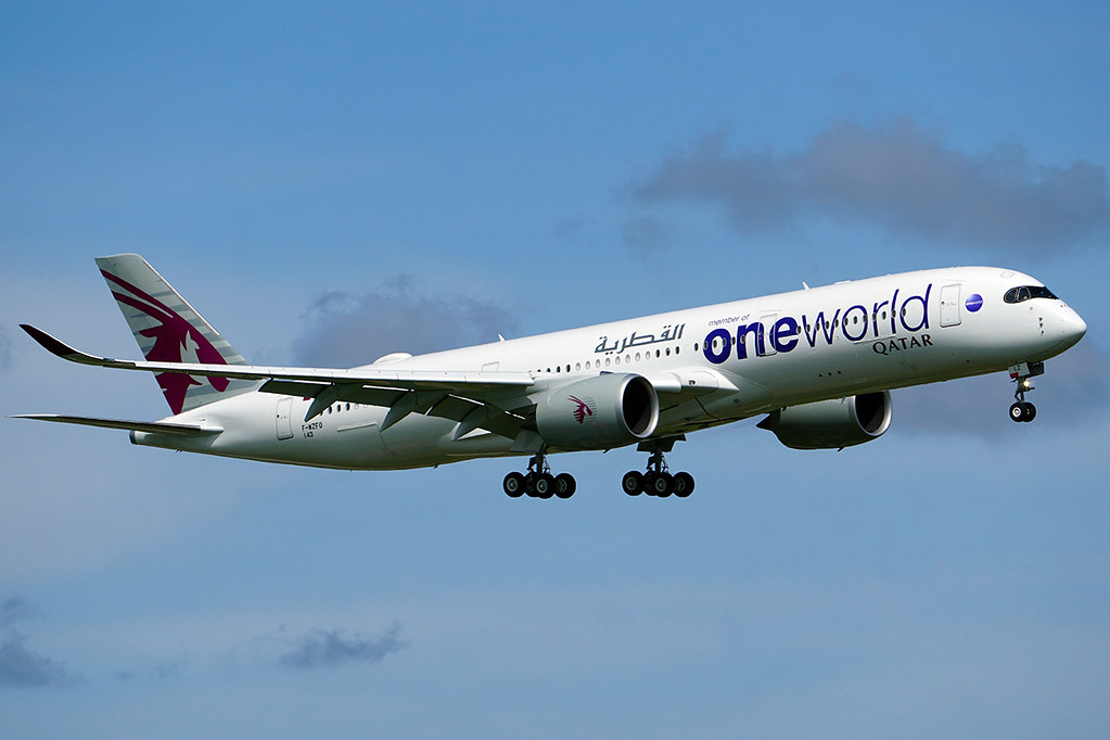 a white airplane flying in the sky