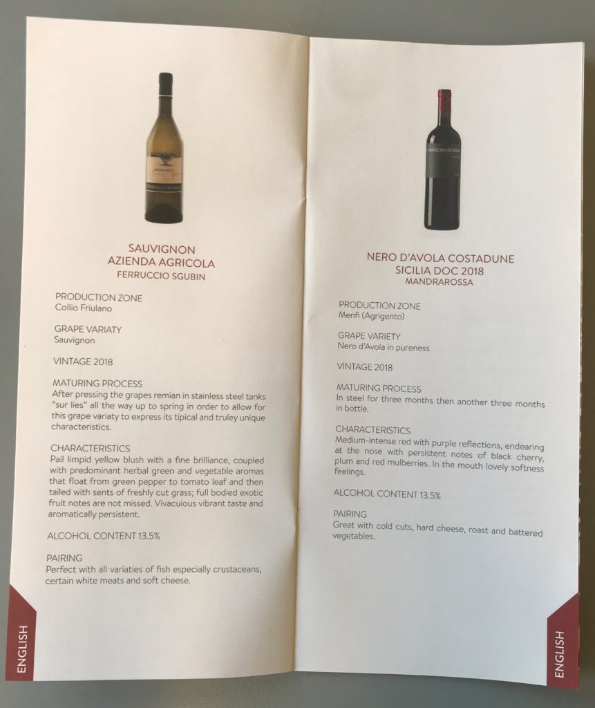 a menu with a bottle of wine