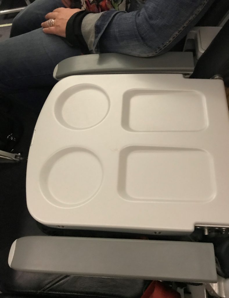 a white tray with a couple plates on it