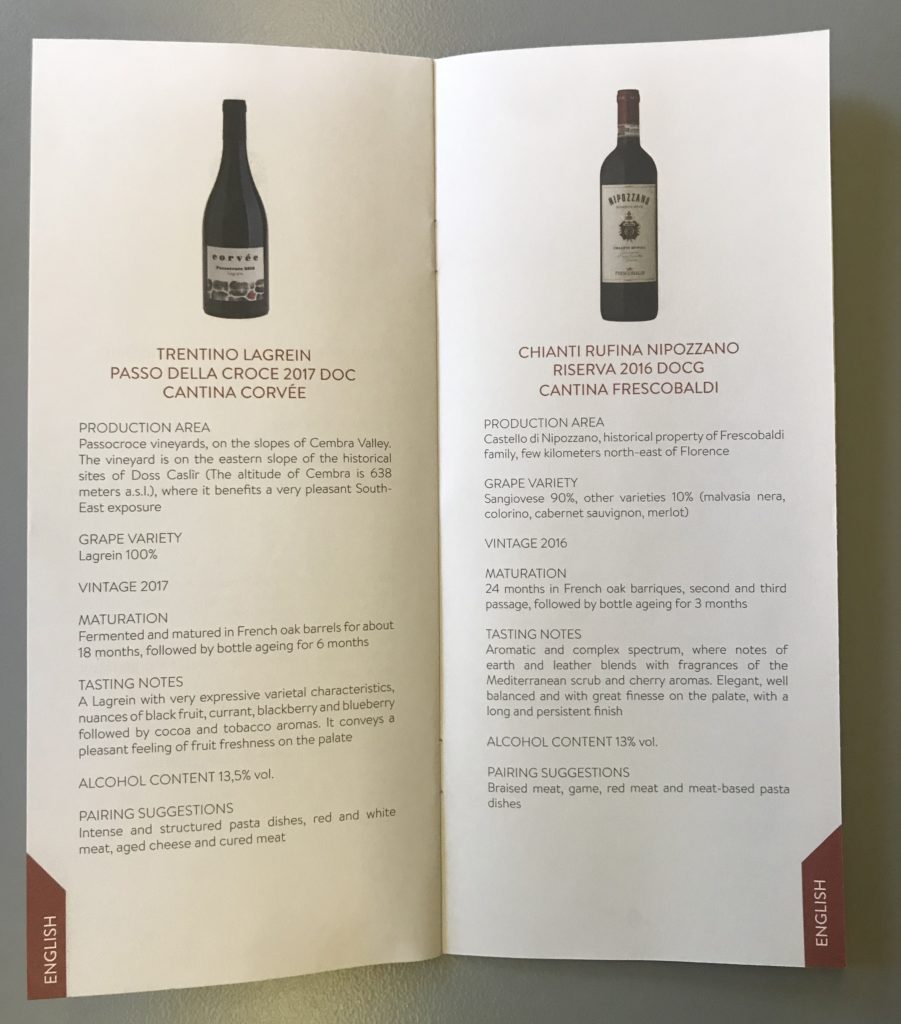 a menu with a bottle of wine