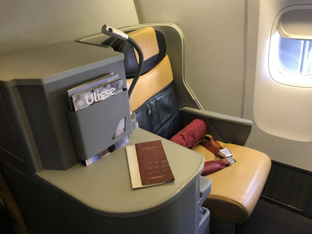a seat with a book and a wallet on it