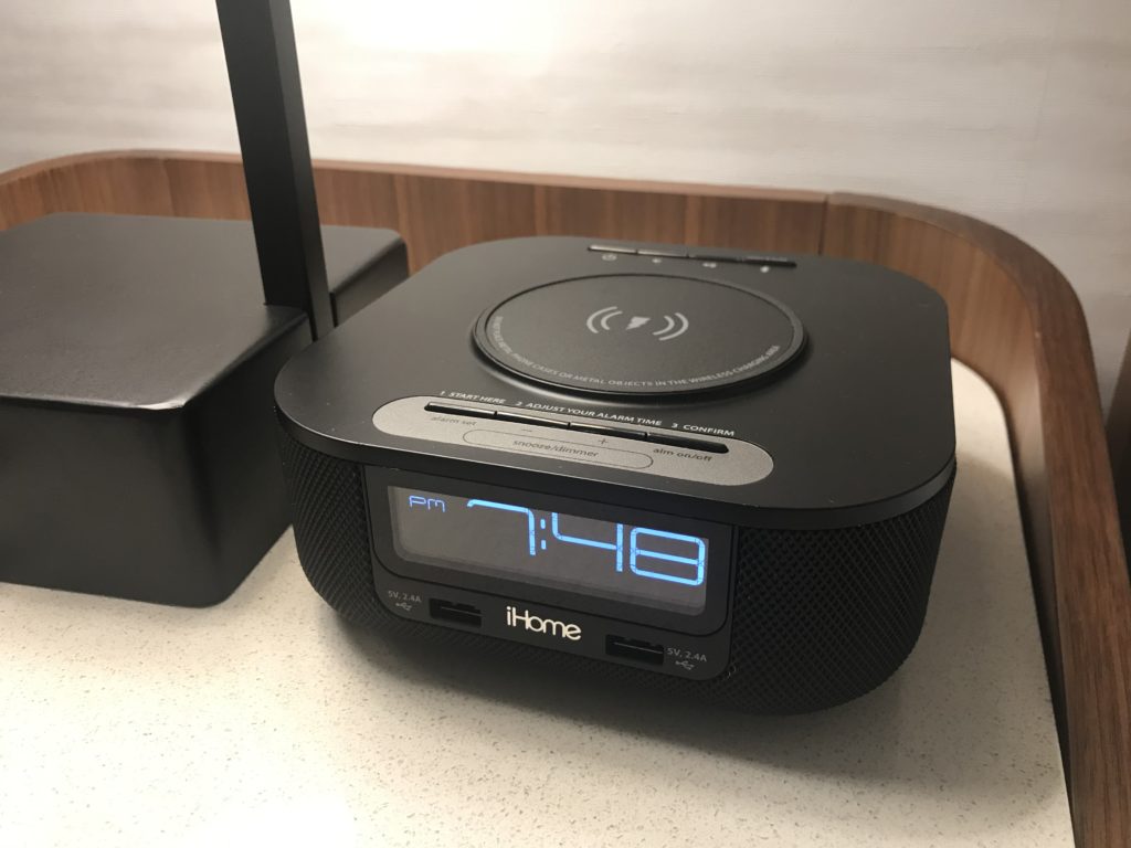 a black alarm clock on a table
