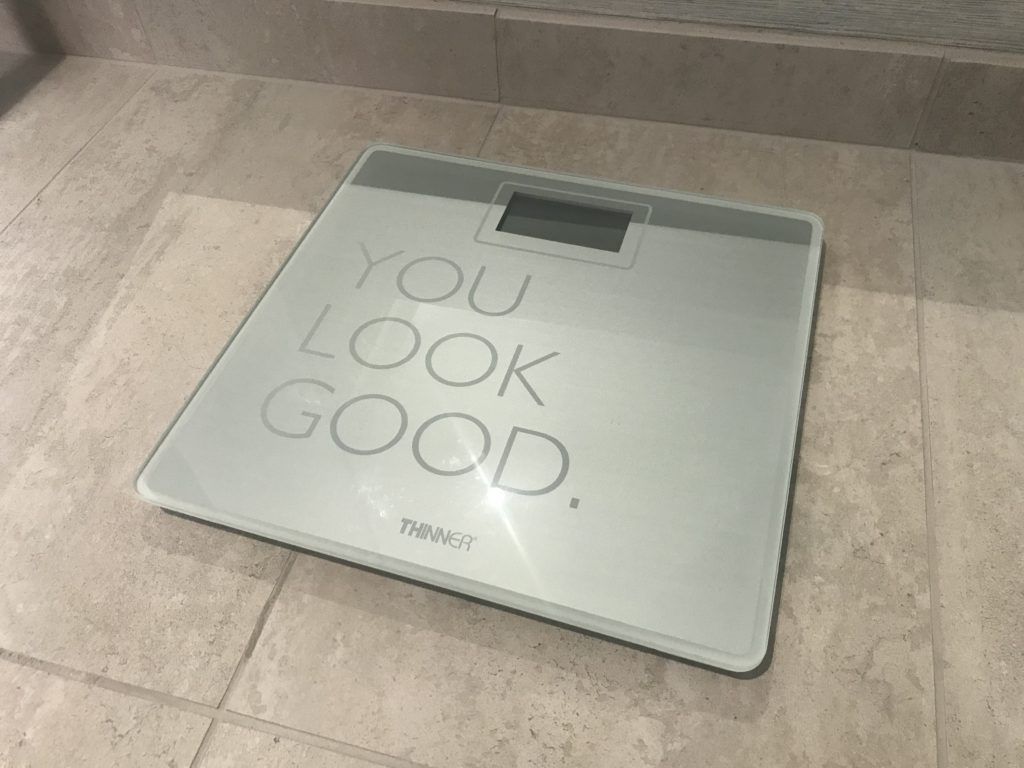 a scale on a tile floor