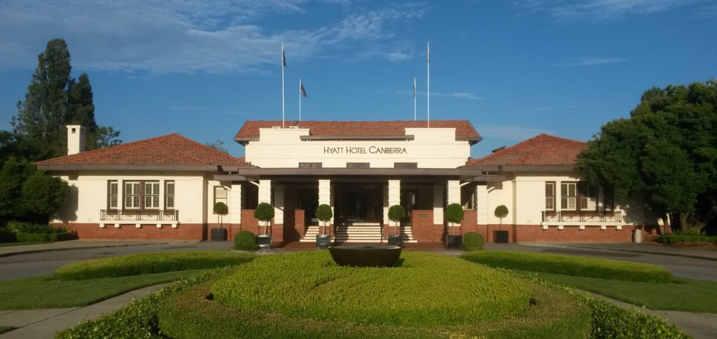 a building with a fountain in front of it