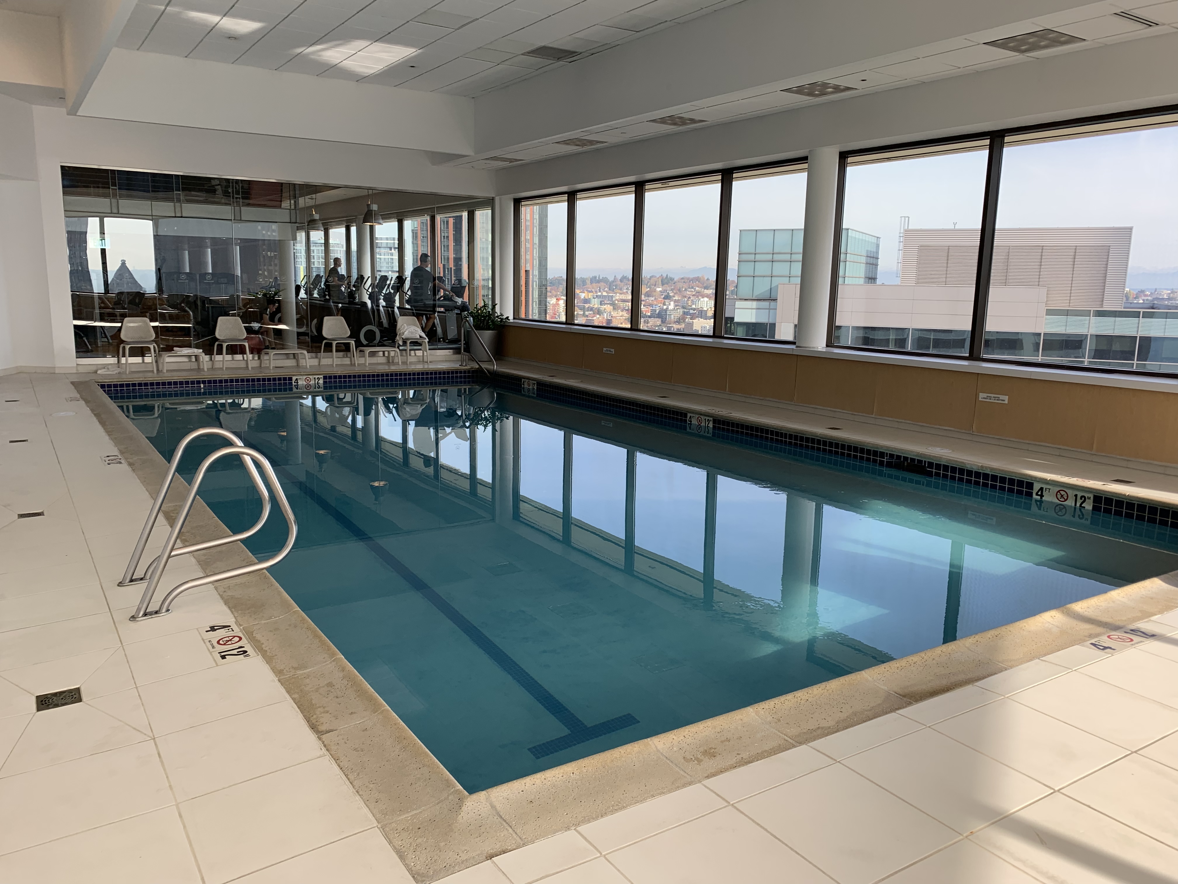 a indoor swimming pool with a large window