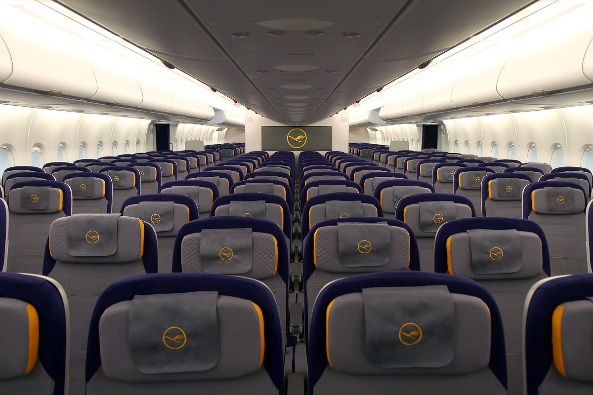 a plane with seats and a screen