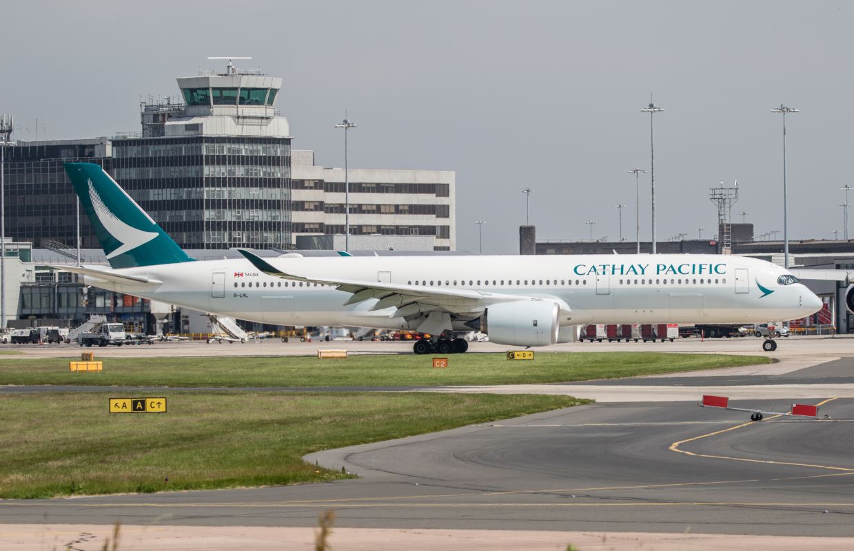 a white airplane on a runway