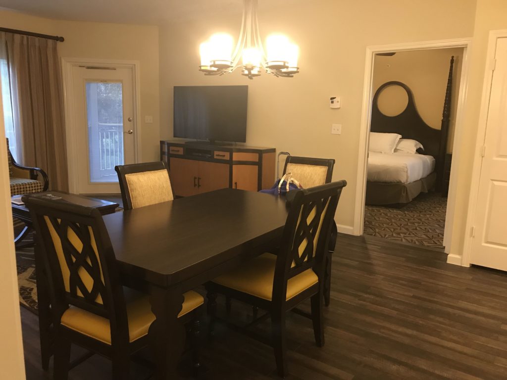 a room with a table and chairs