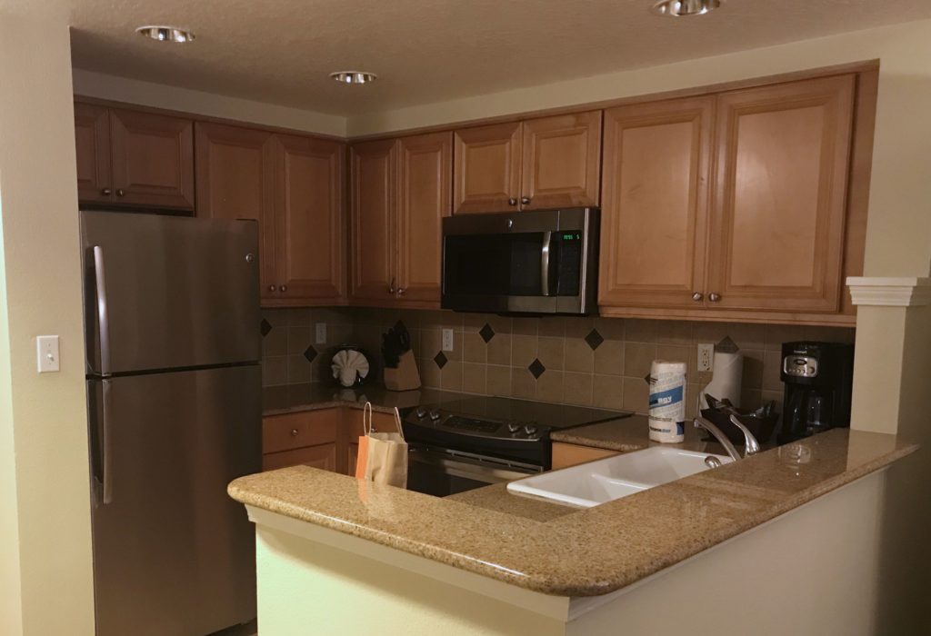 a kitchen with a counter top and a microwave