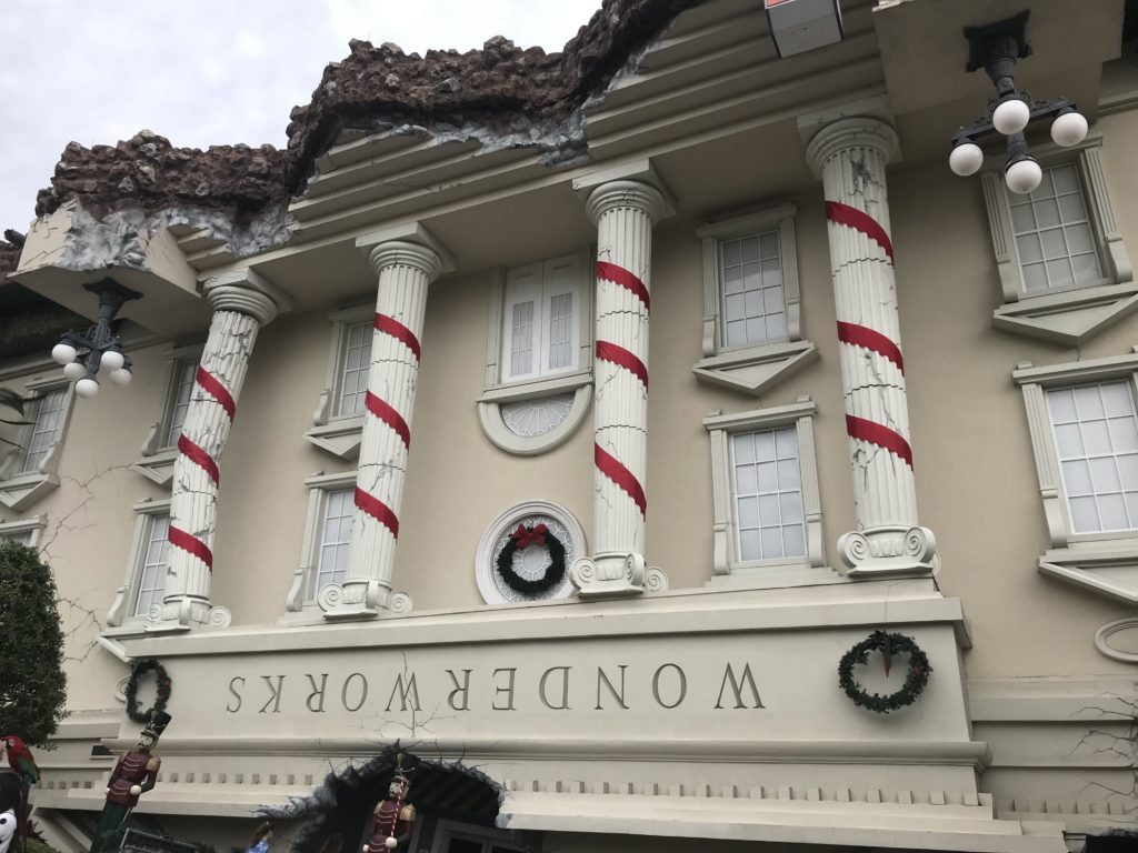 a building with columns and a sign