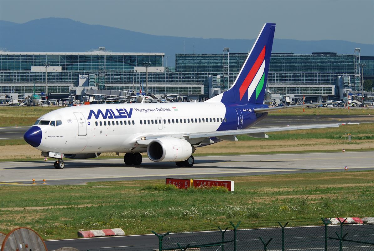 a white airplane on a runway