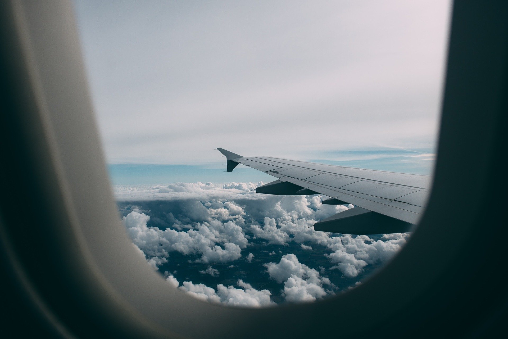 an airplane wing and clouds