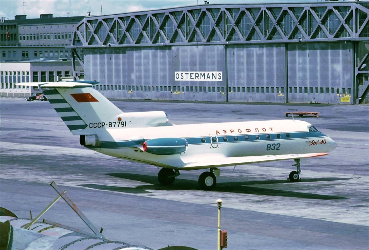 a white airplane on a runway