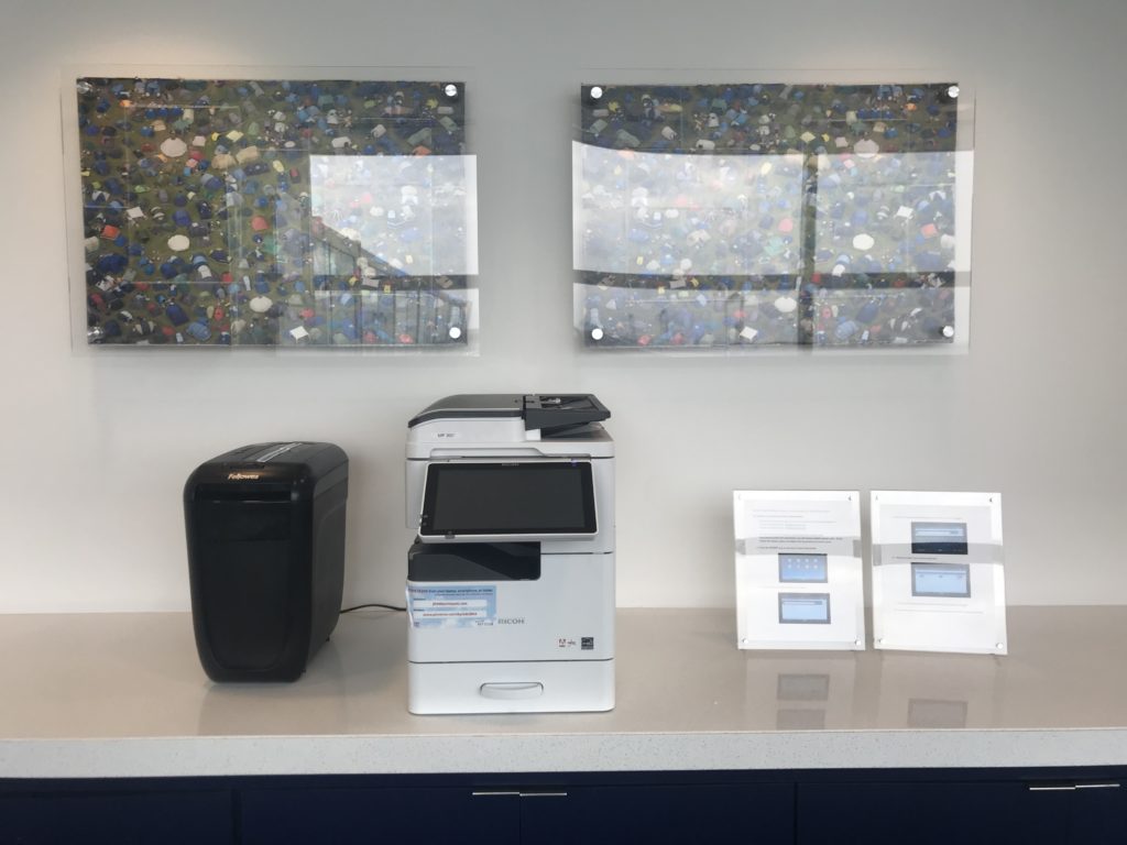 a printer and copier on a counter