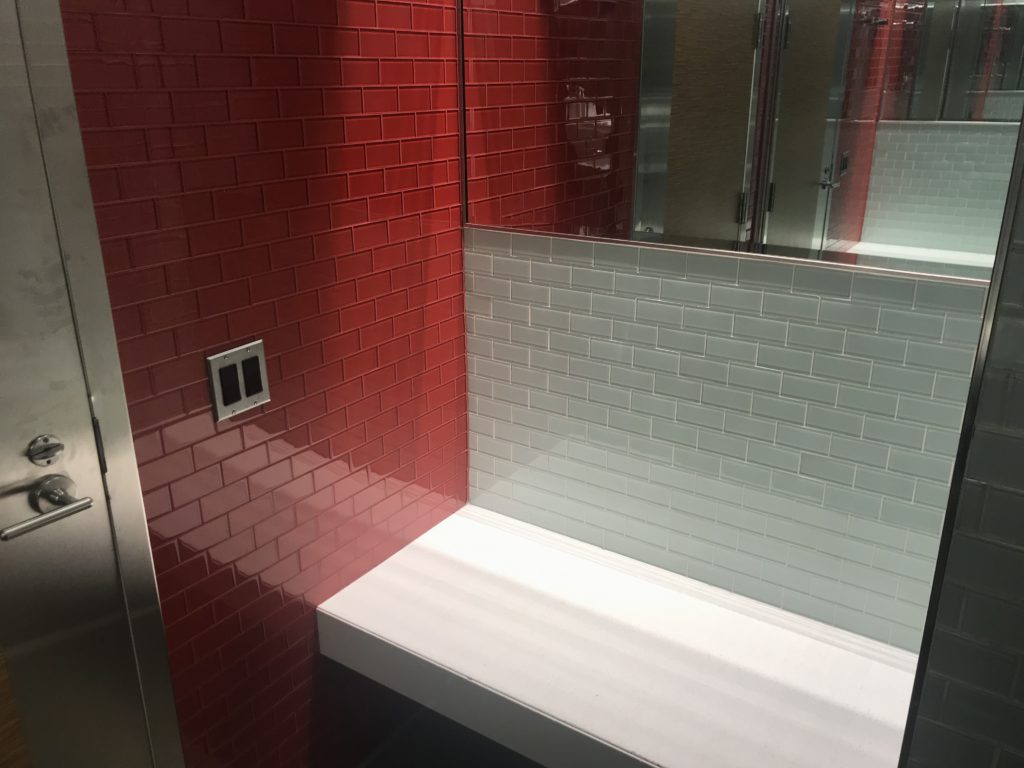 a red and white tiled wall