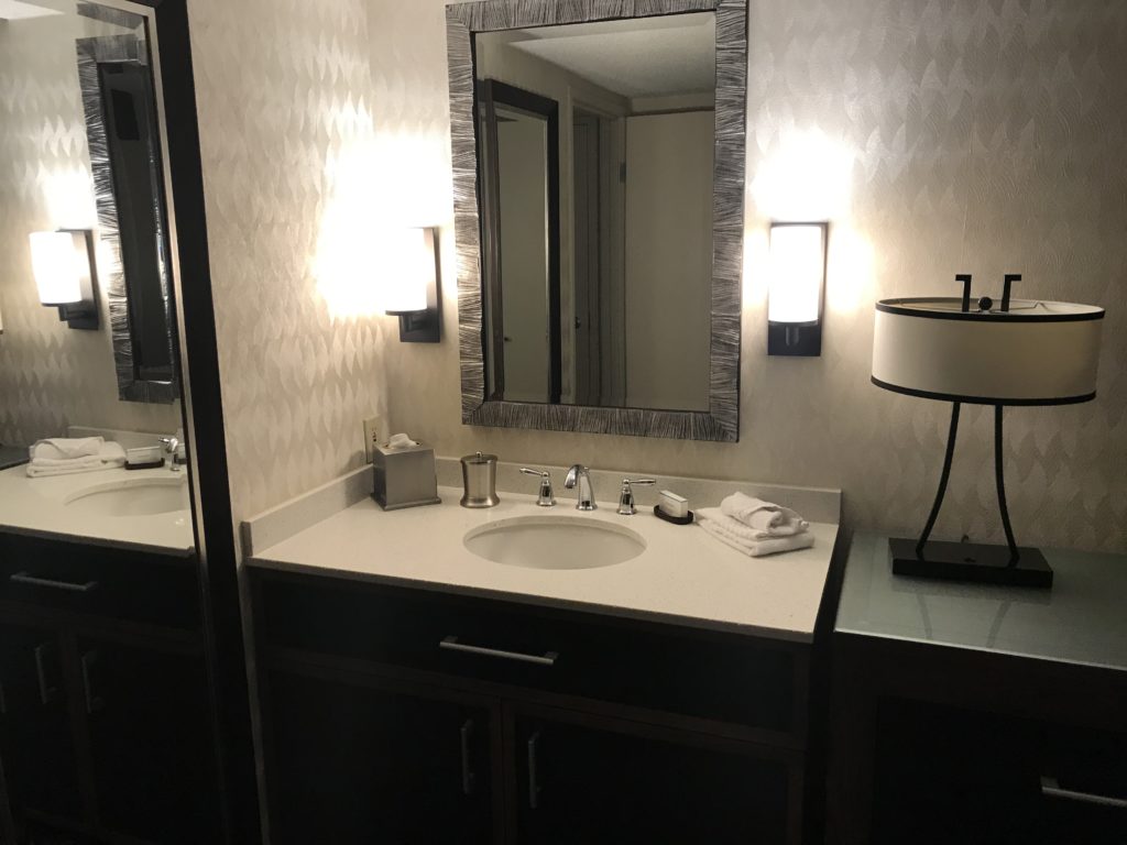 a bathroom with a mirror and sink