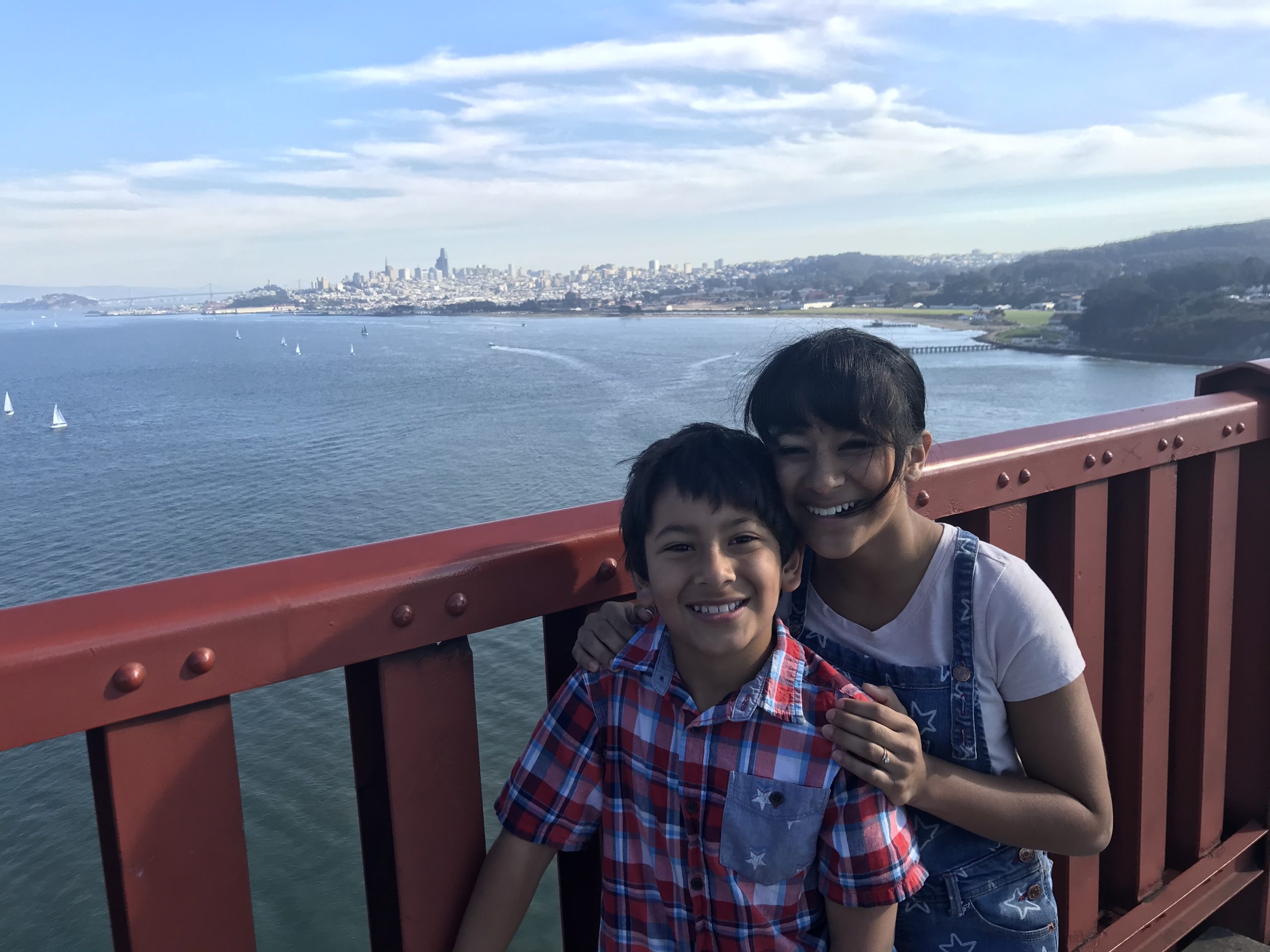 a boy and girl posing for a picture