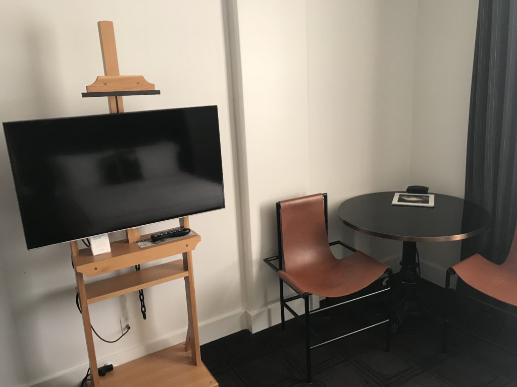 a chair and a tv in a room