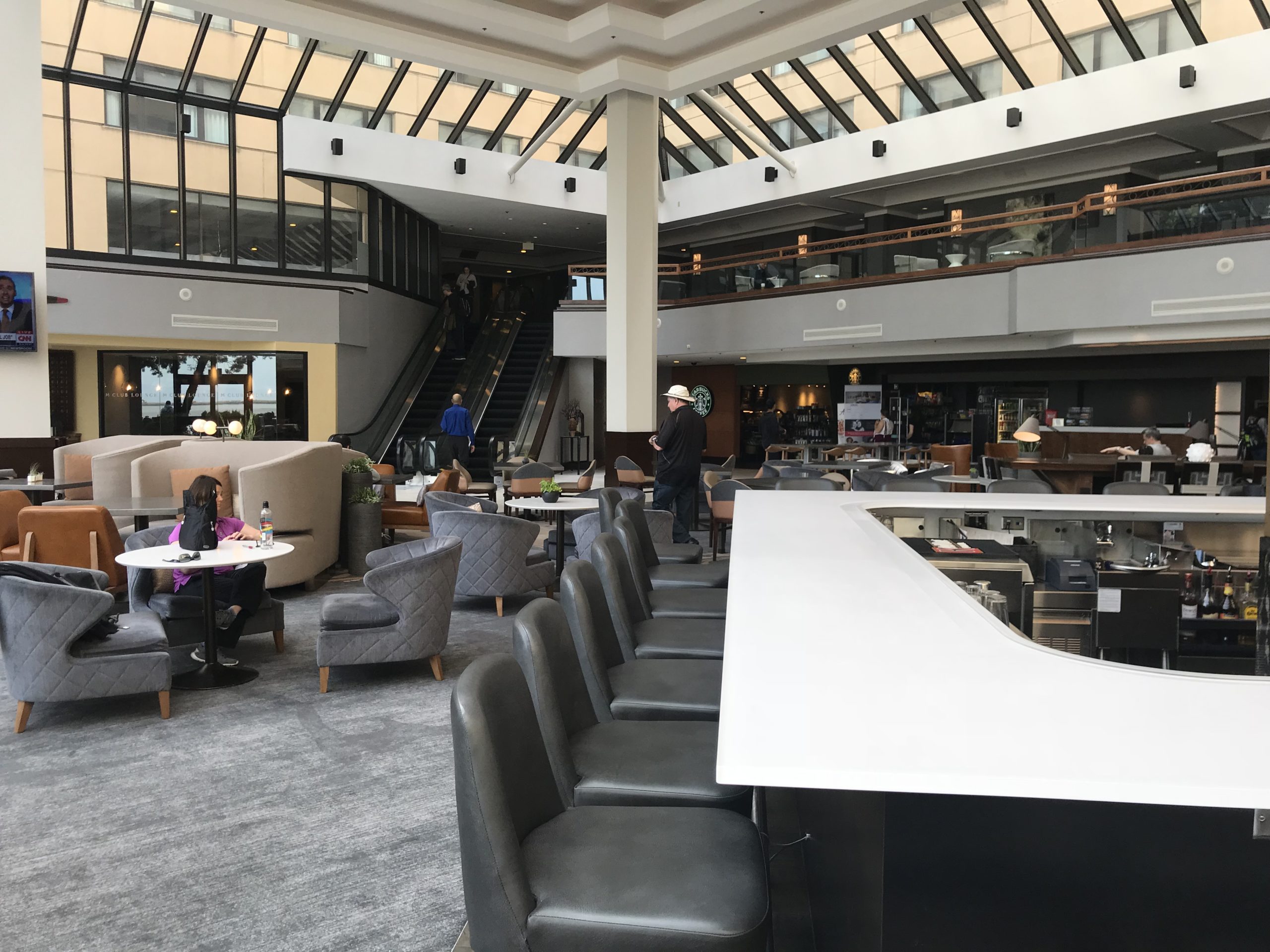 a large room with a large counter and chairs