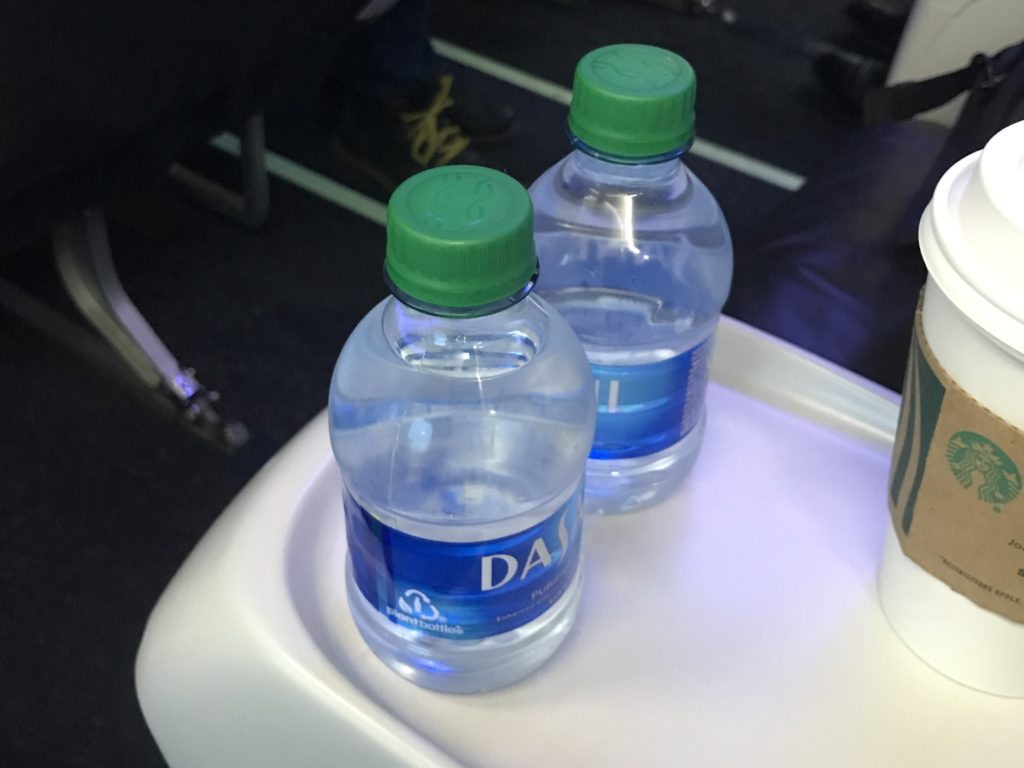 two bottles of water on a tray
