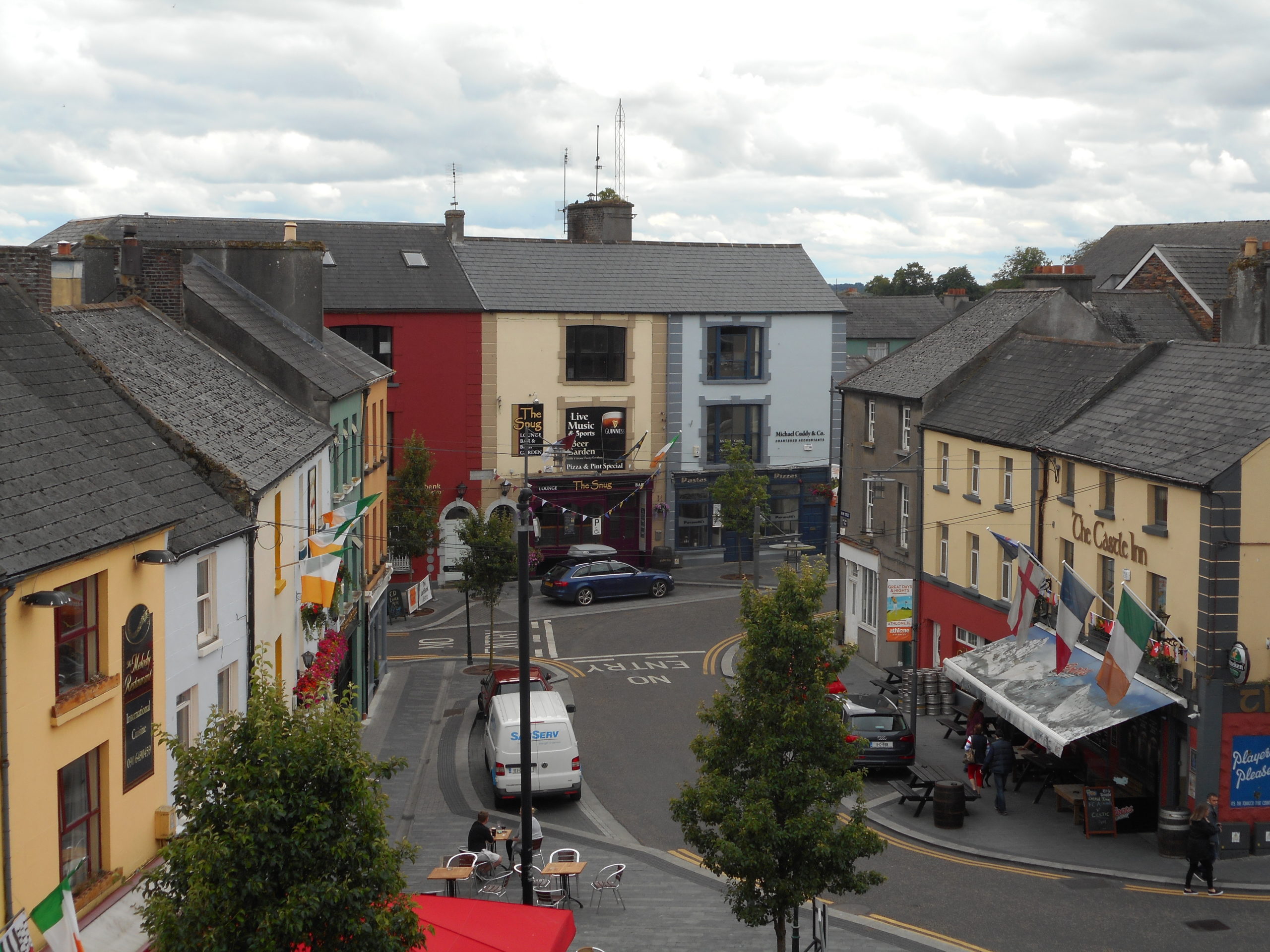 a street with cars and buildings