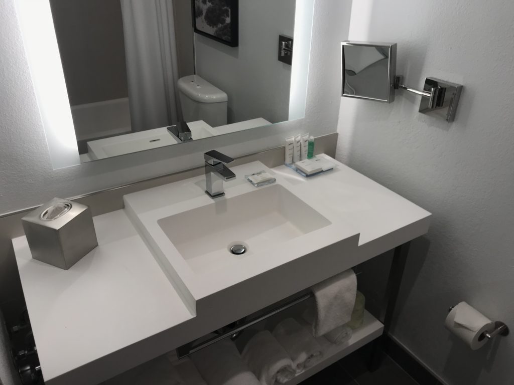 a bathroom sink with a mirror