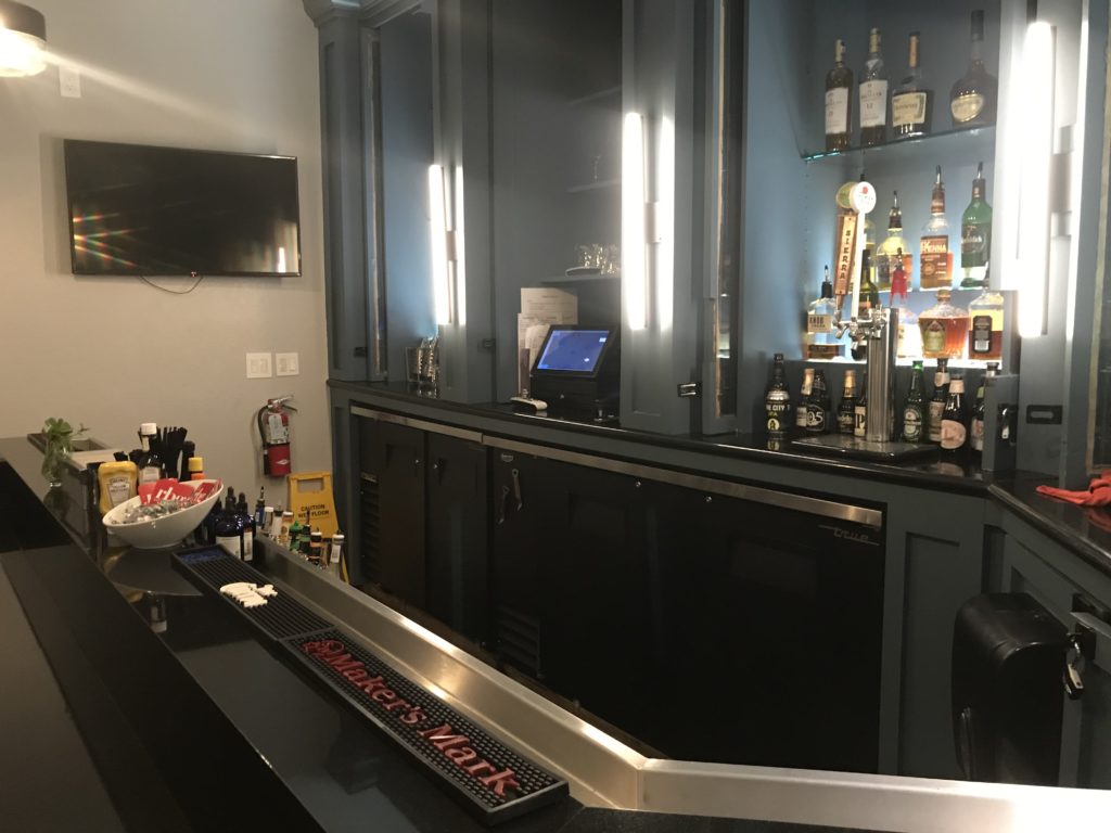 a bar with bottles and alcohol