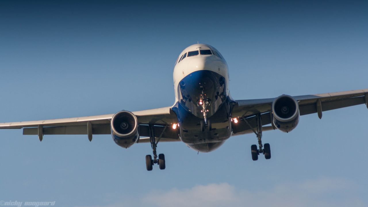 a plane flying in the sky