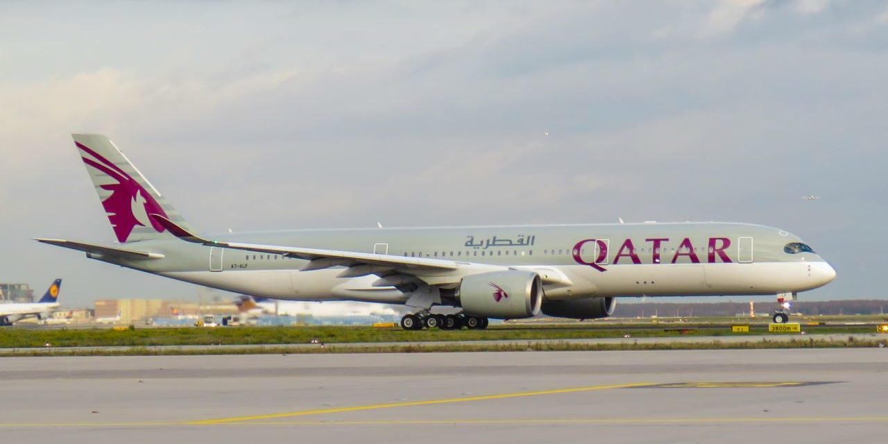 Did you receive a Qatar Airways travel voucher just for booking?