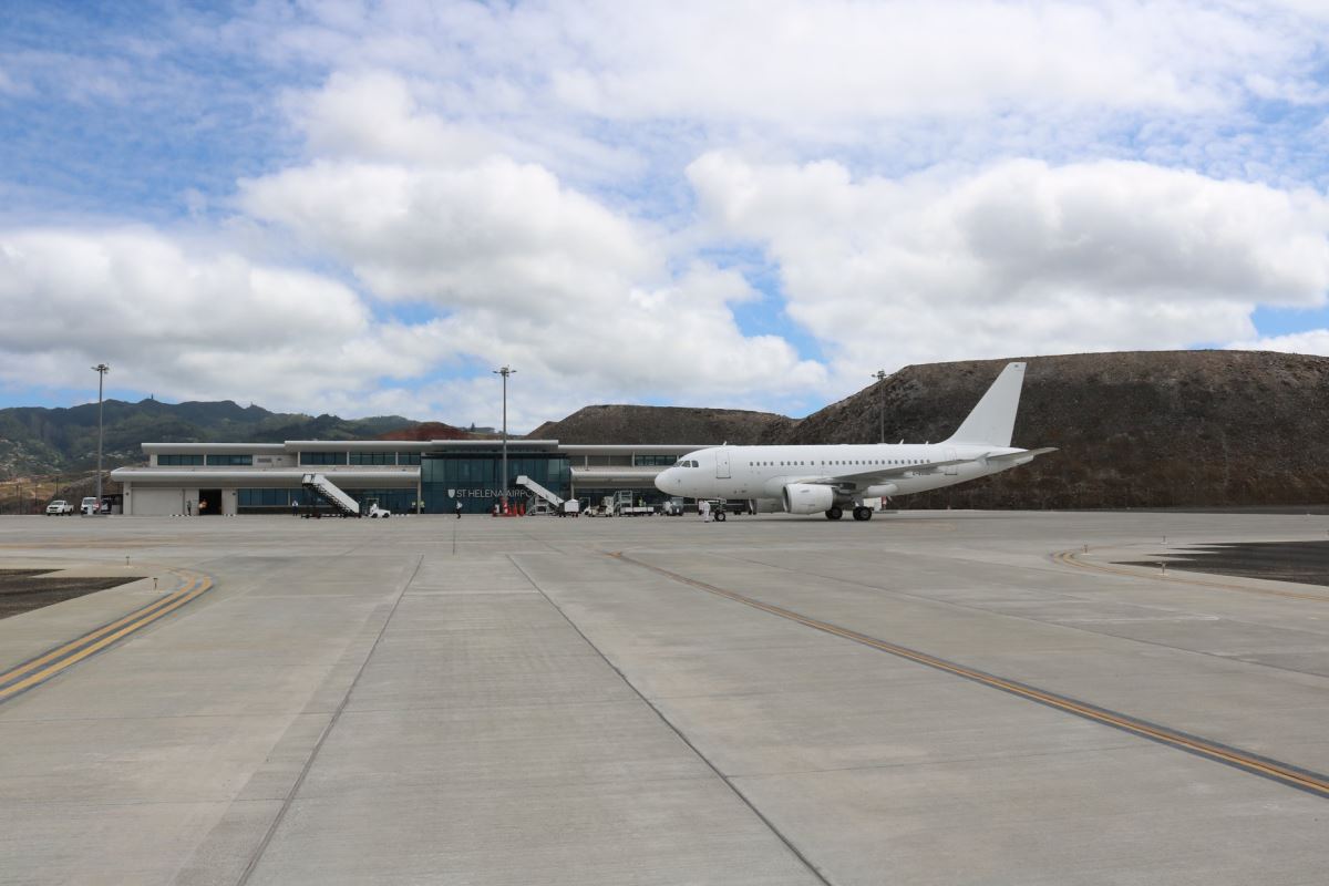 a white airplane on a runway