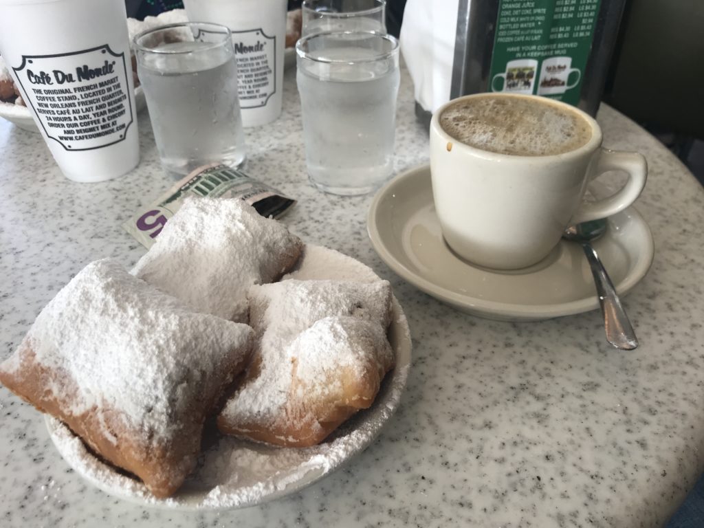 a plate of pastries and a cup of coffee