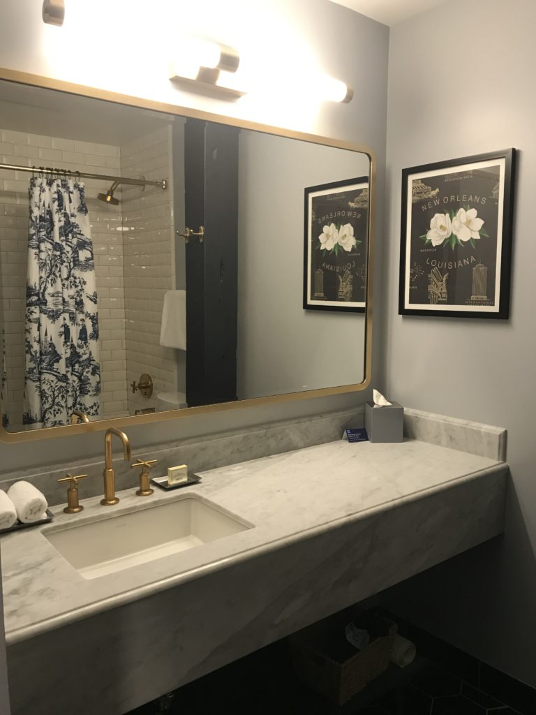 a bathroom with a mirror and sink