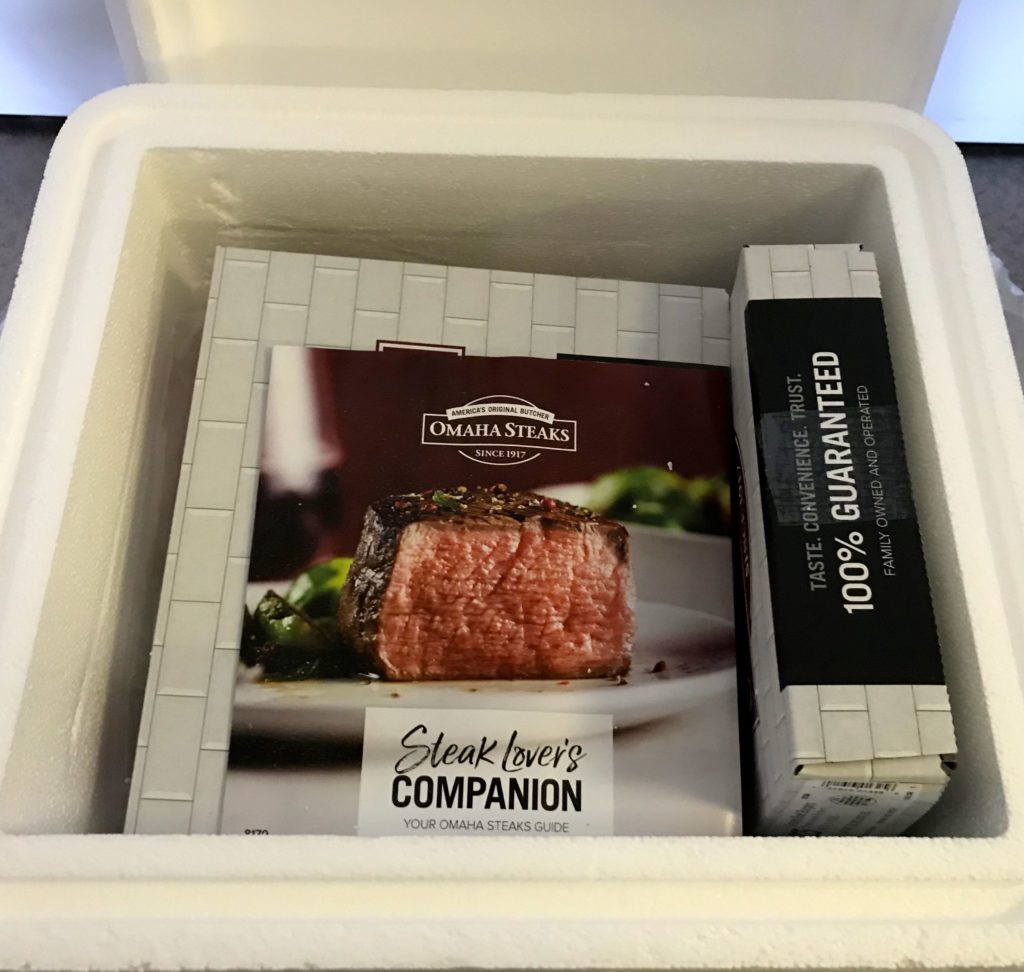 a box of steaks in a styrofoam container