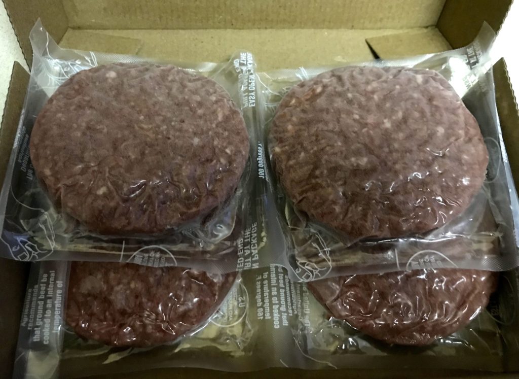 a group of burger patties in plastic bags