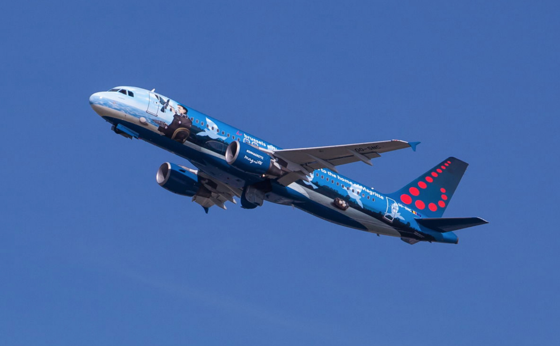 a blue airplane with a cartoon on it