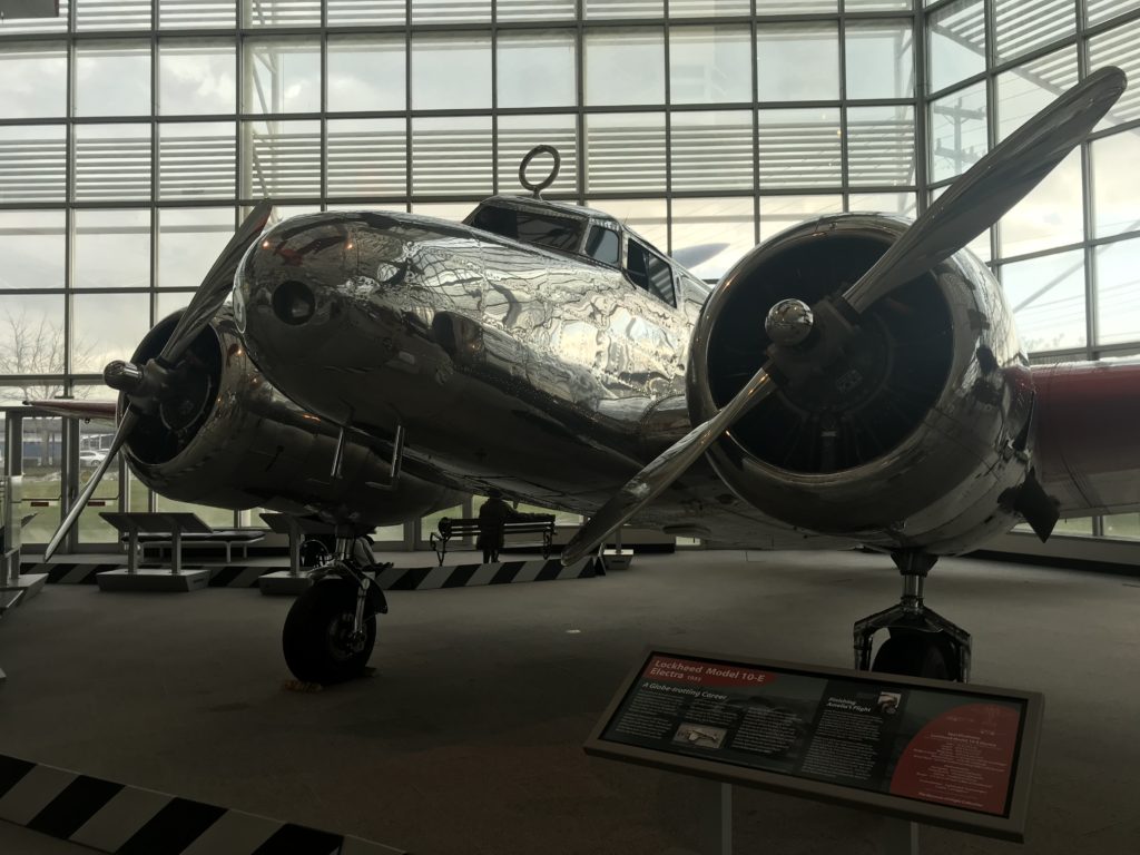a silver airplane in a building