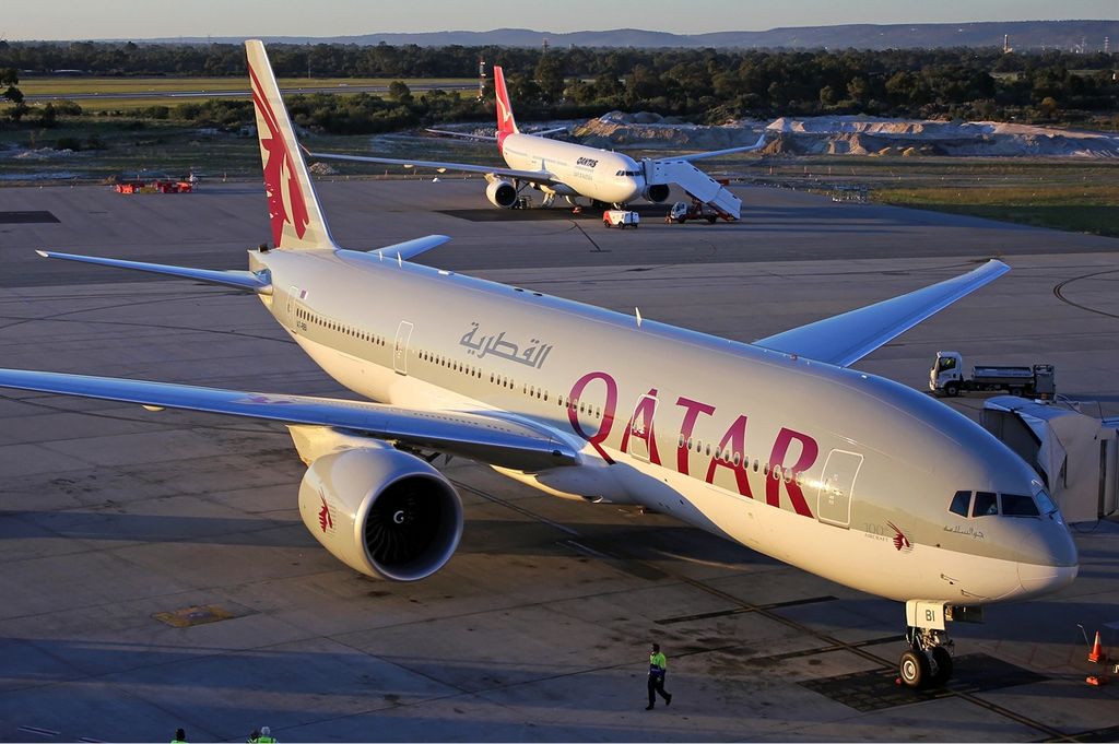 a group of airplanes on a runway