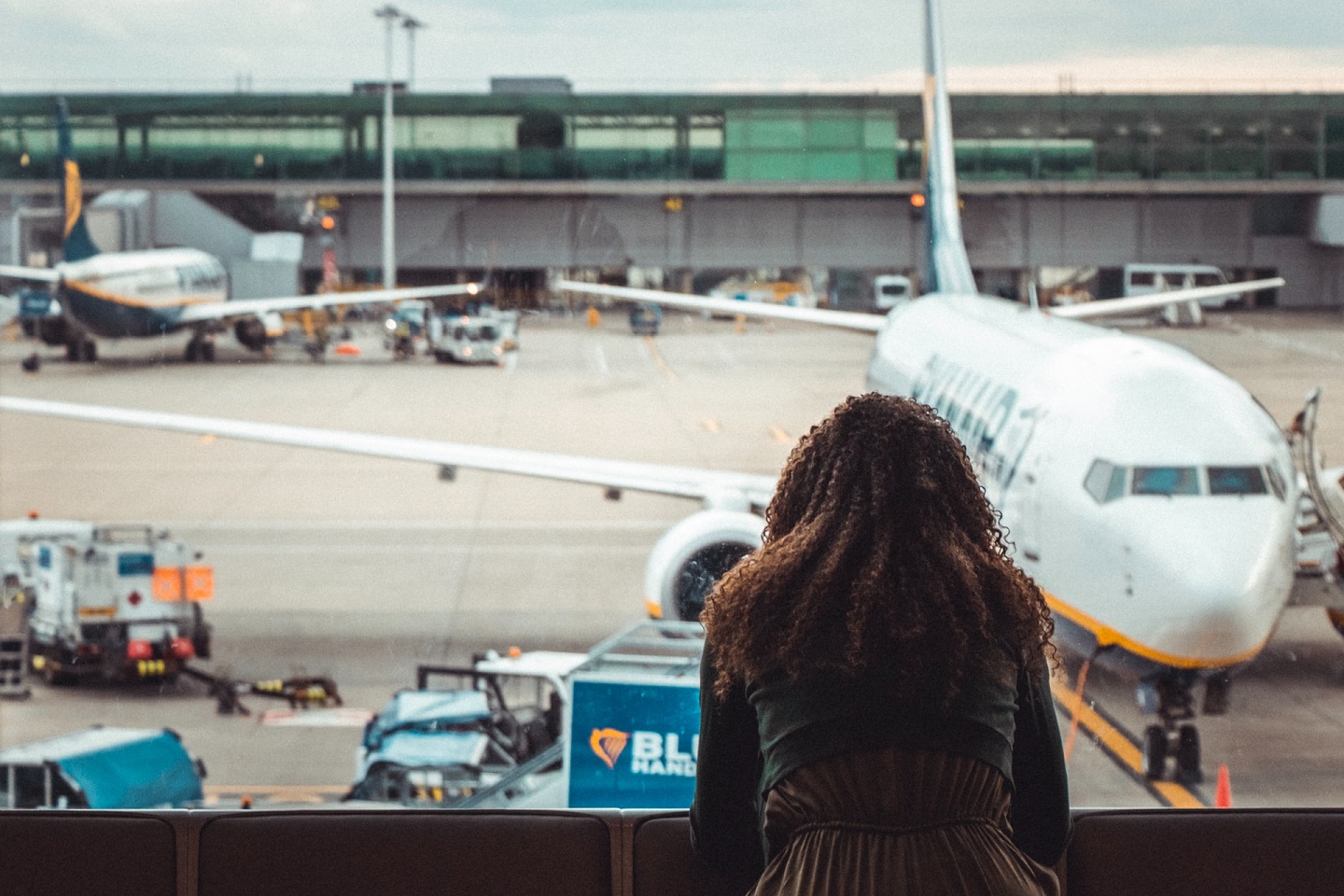 a woman looking at an airplane