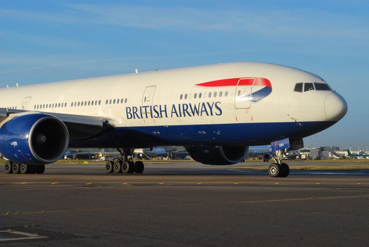 a large white airplane on a runway