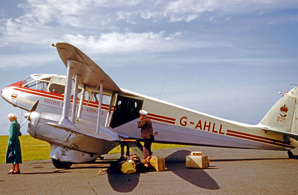 a man standing next to an airplane