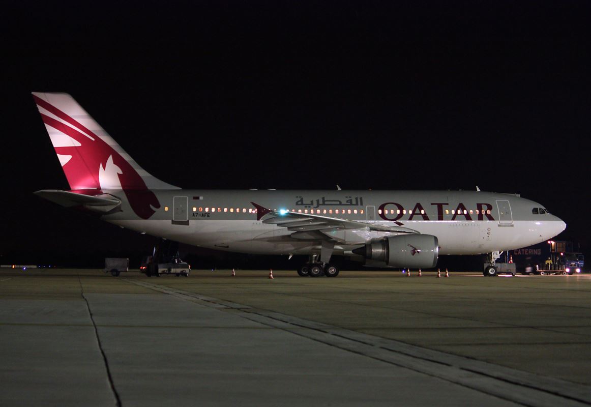 a plane on the runway at night