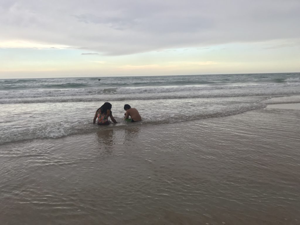 two people playing in the water