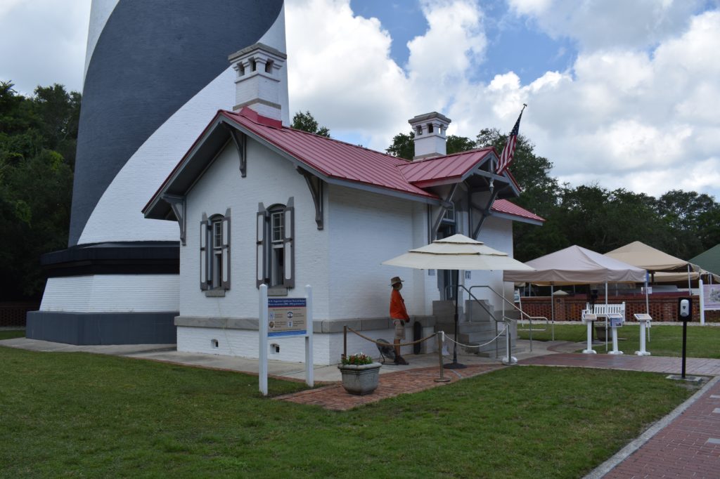 a white building with a red roof