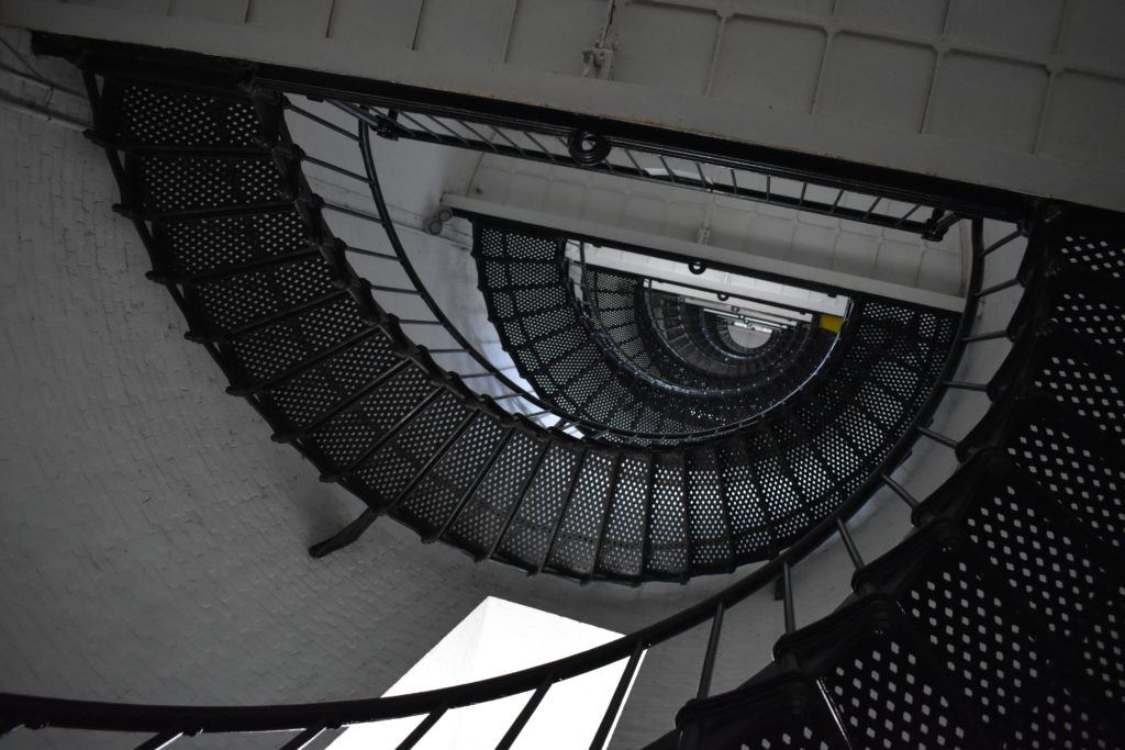a spiral staircase with black railings