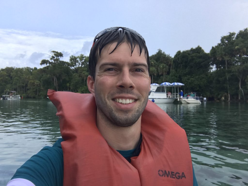 a man taking a selfie in a body of water