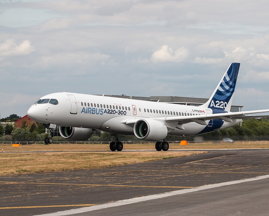 a white airplane on a runway