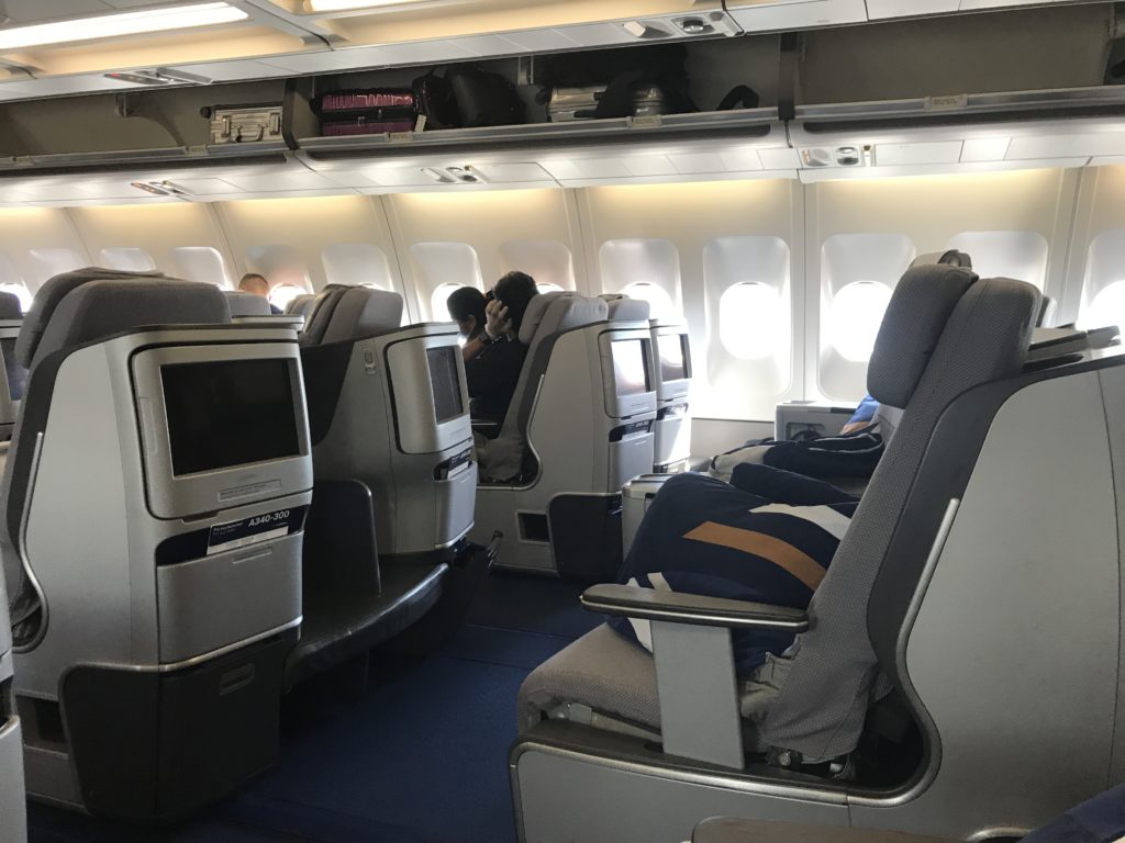 a group of people sitting in an airplane